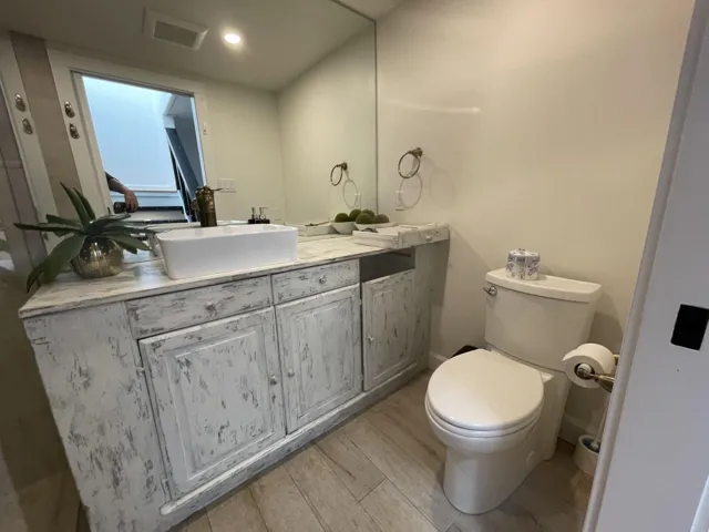 Bathroom featuring vanity and light wood-type flooring