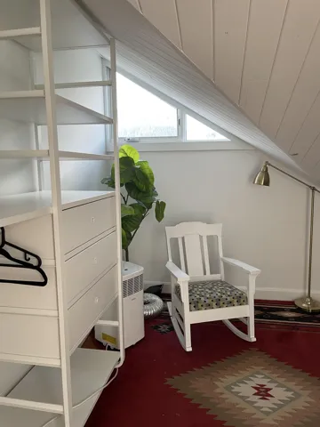 Living area featuring dark carpet