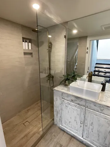 Bathroom with vanity and walk in shower