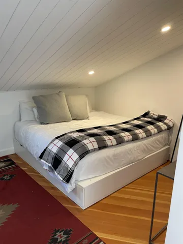 Bedroom with wood finished floors and recessed lighting