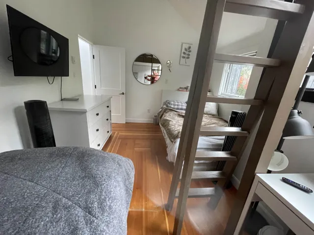 This 5th level Lofted Ceiling Bedroom has East (Morning Sun) facing windows, and 3 beds.