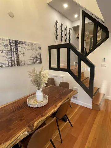 Dining area featuring wood finished floors and baseboards