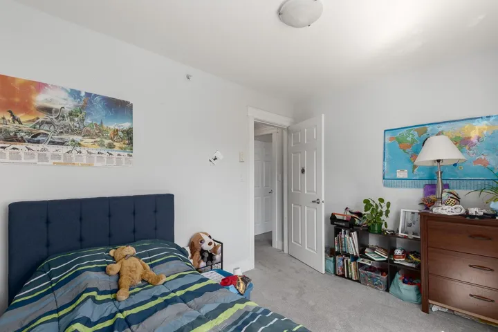 Carpeted bedroom with baseboards
