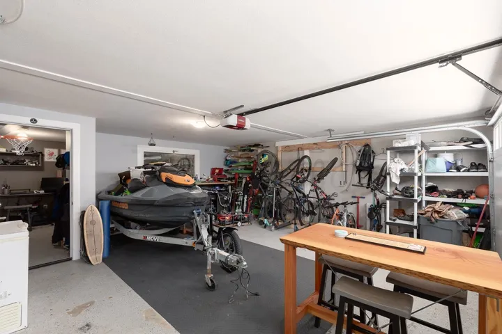 Garage with a workshop area and a garage door opener