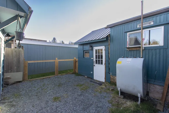 View of outdoor structure featuring oil tank