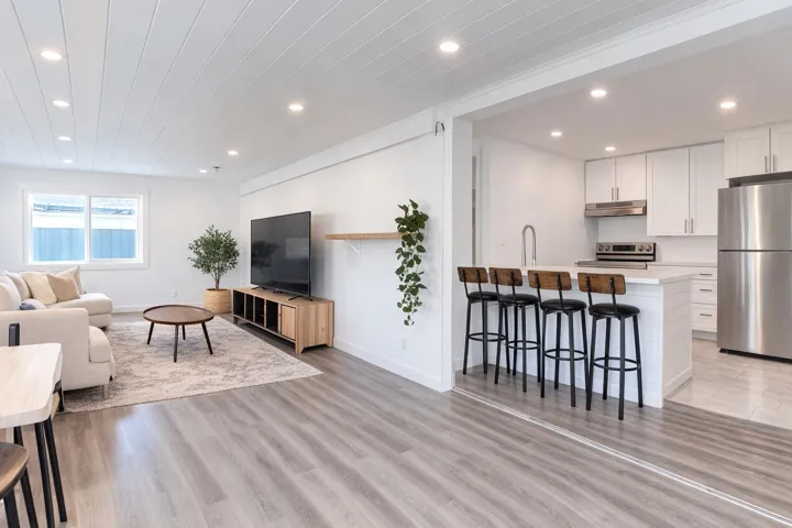 Living area with recessed lighting and light wood finished floors
