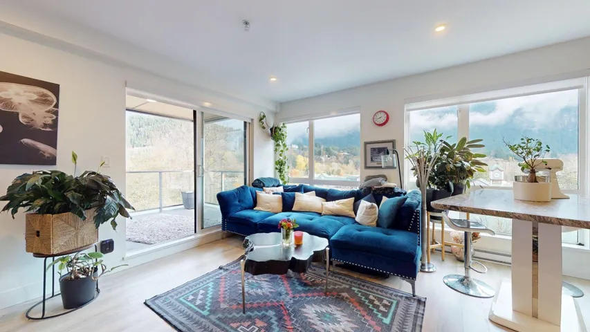 Living area with wood finished floors and recessed lighting