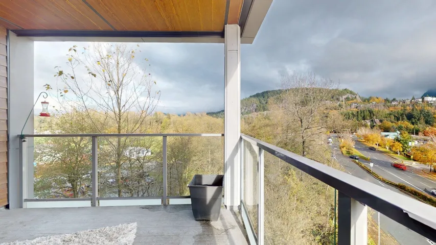 Balcony with a wooded view