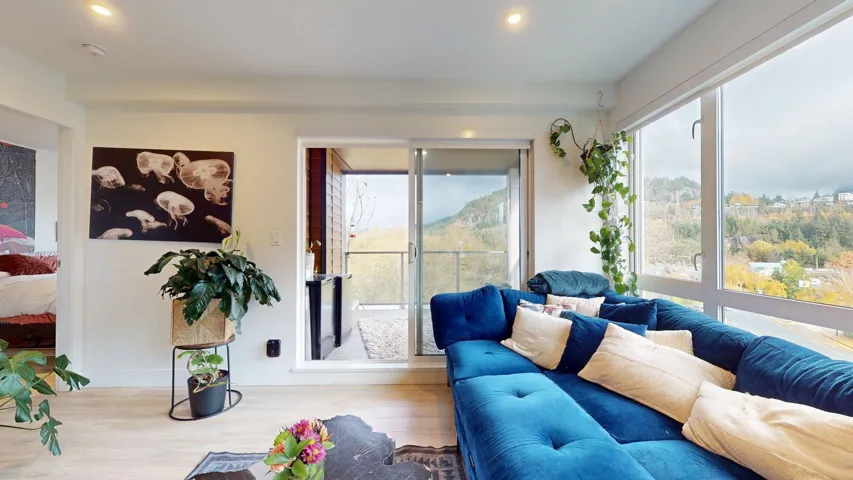 Living room with wood finished floors and recessed lighting