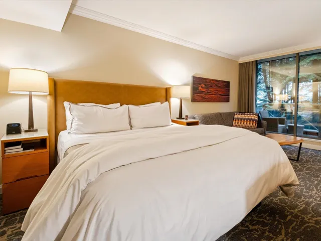 Bedroom featuring access to exterior, a skylight, and crown molding