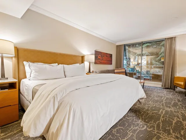 Bedroom with carpet floors, a skylight, and crown molding