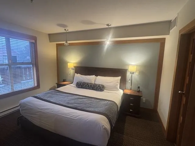 Bedroom with a baseboard radiator and baseboards