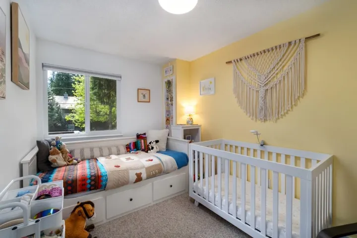 Bright room with a large window and light-colored walls