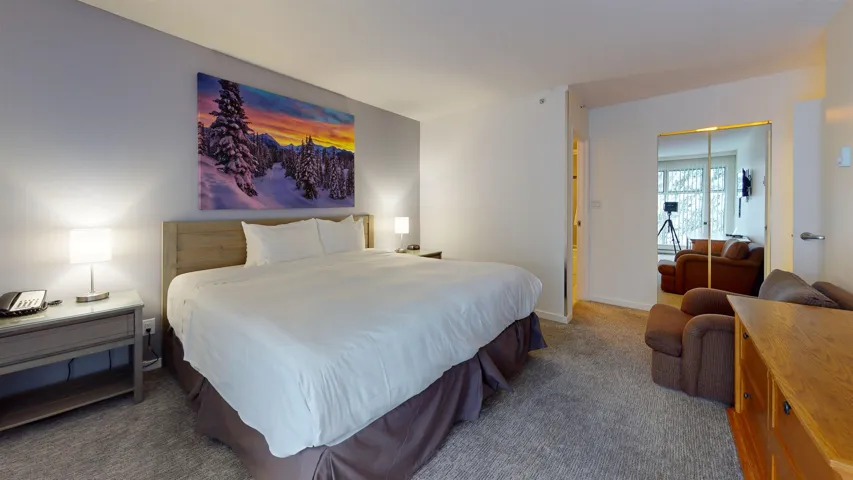 Bedroom featuring carpet flooring and a closet