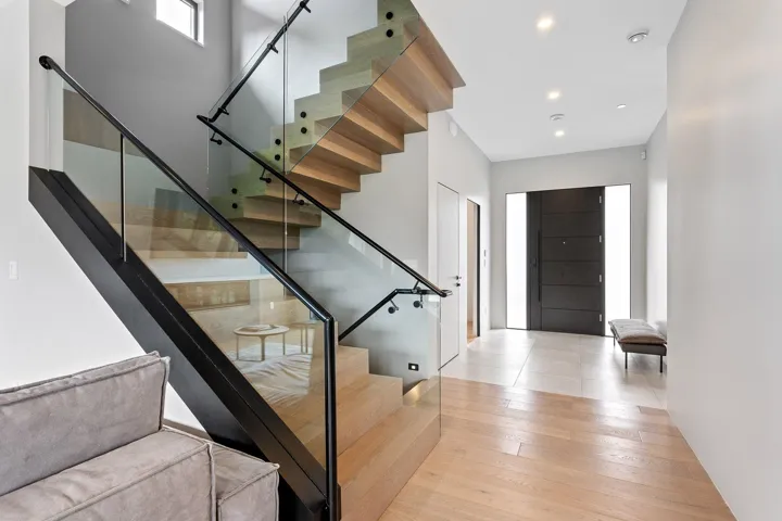 Entrance foyer with stairs, recessed lighting, and wood finished floors