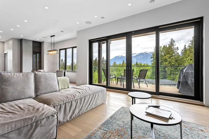 Living area with recessed lighting, light wood-style flooring, and a mountain view