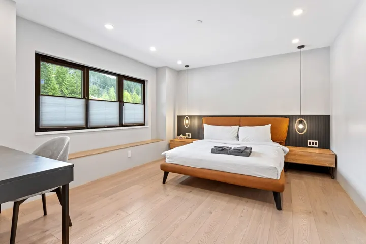 Bedroom with light wood-style floors and recessed lighting