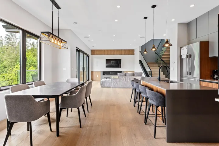 Dining area featuring stairs, light wood-style flooring, and recessed lighting