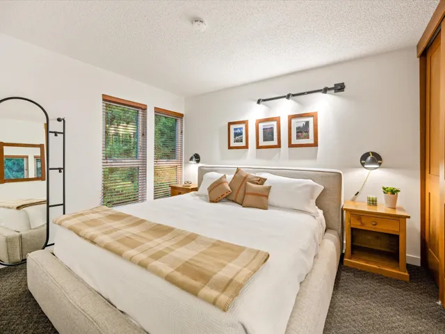 Carpeted bedroom featuring a textured ceiling