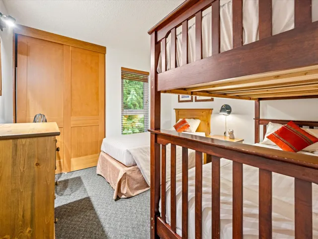 Carpeted bedroom featuring a textured ceiling