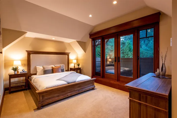 Bedroom 2 has on-suite bathroom and a balcony looking into the backyard.