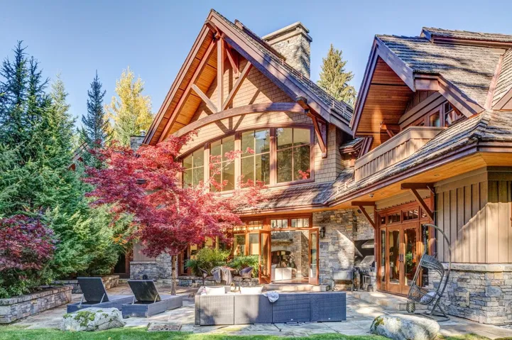 Back of property featuring a patio, french doors, an outdoor hangout area, and a chimney