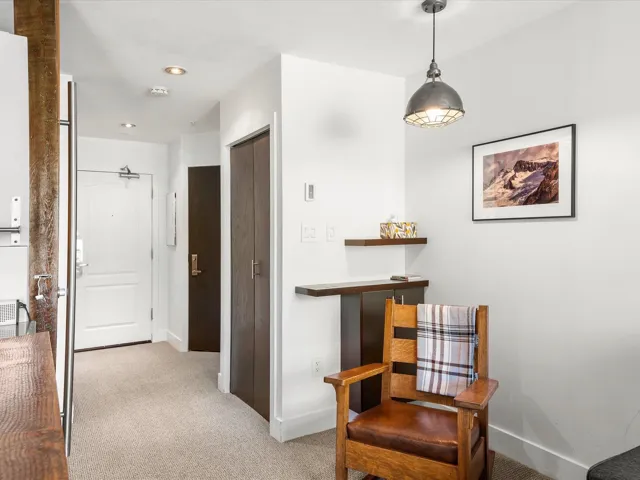 Sitting room with light carpet and baseboards