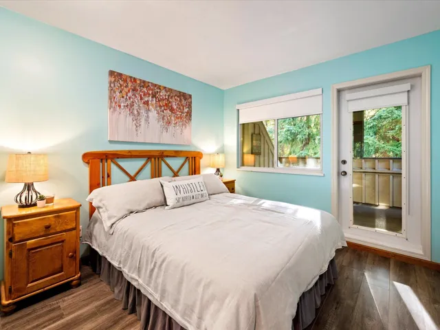Bedroom with dark wood-style floors