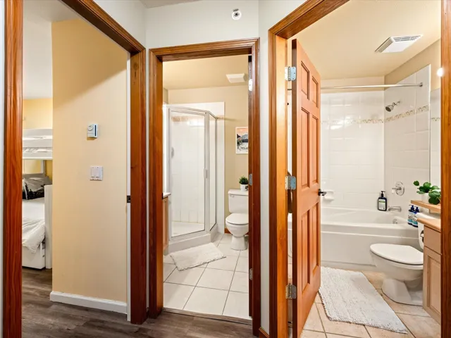 Bathroom with tile patterned flooring and connected bathroom