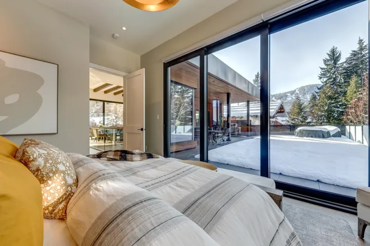 Bedroom with a mountain view and access to outside