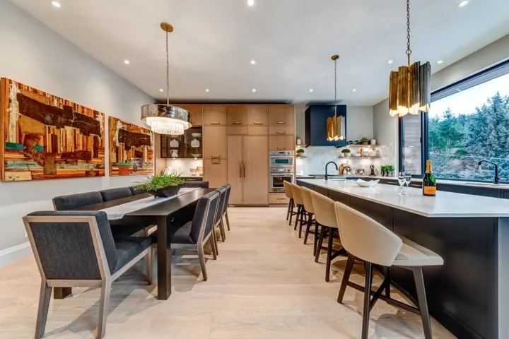 Dining area with light wood-style flooring and recessed lighting