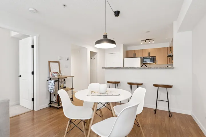 Dining area with light wood finished floors