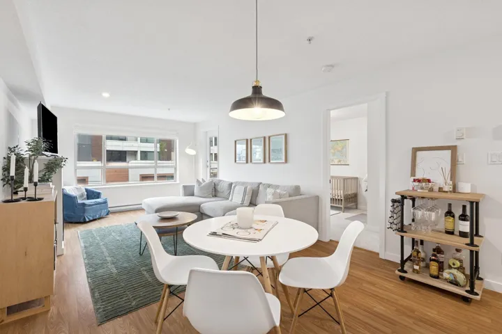 Dining area with light wood-style floors, recessed lighting, and baseboard heating