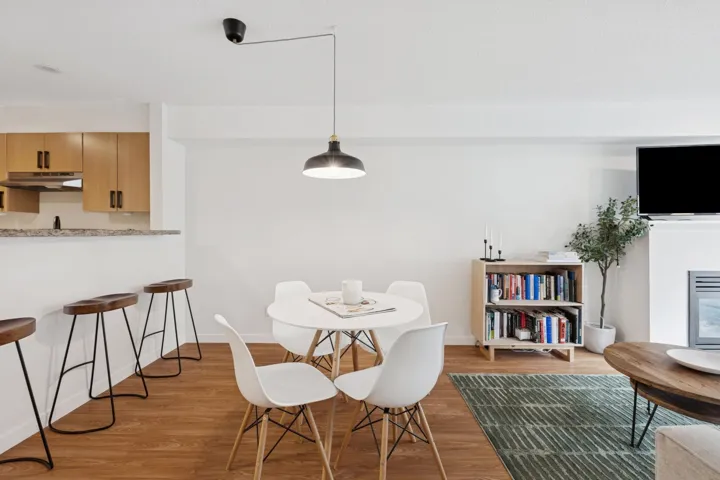 Dining room featuring wood finished floors and baseboards