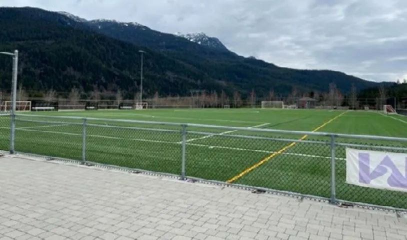 View of home's community with an area for sports and a mountain view