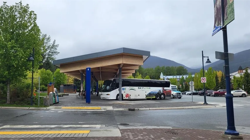 Exterior space with curbs, sidewalks, traffic signs, and a mountain view