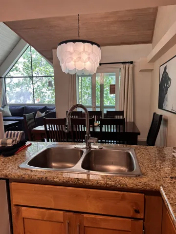 Kitchen with wooden ceiling and lofted ceiling