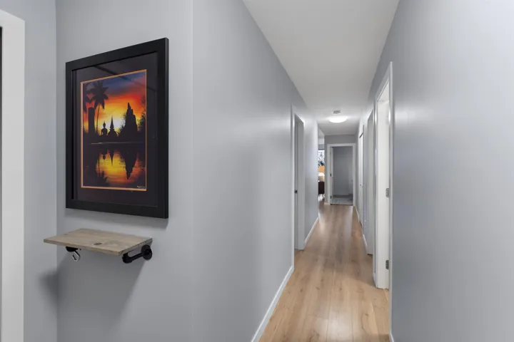 Hall featuring baseboards and light wood-style floors