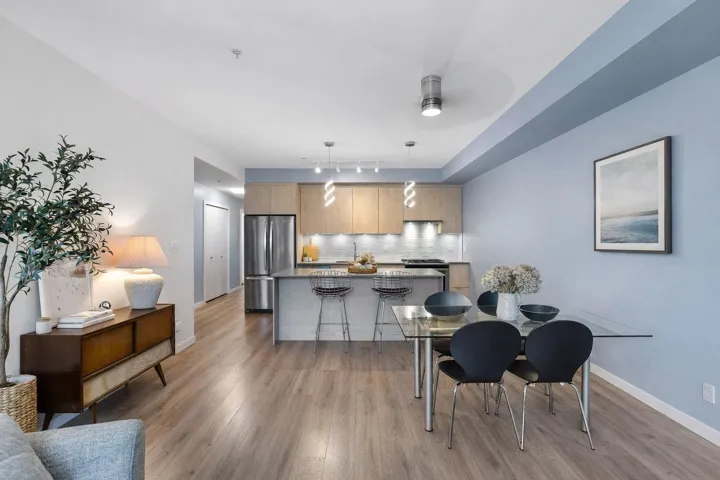 Dining room with light wood-style floors and baseboards