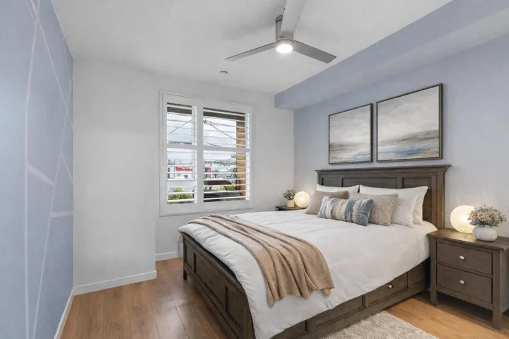 Bedroom with hardwood / wood-style flooring and a ceiling fan