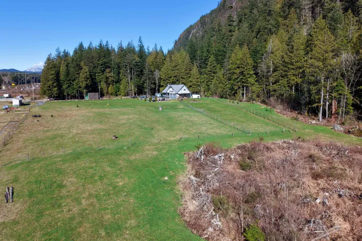 View of green lawn featuring a view of rural / pastoral area and a mountain view
