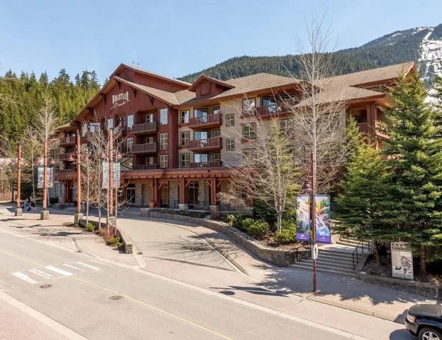 View of apartment building / complex featuring a mountain view