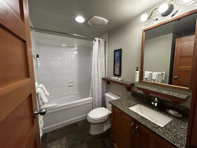 Bathroom featuring vanity and shower / bath combo