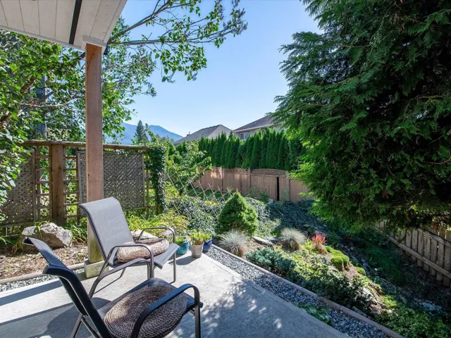 View of patio / terrace with a fenced backyard and a mountain view