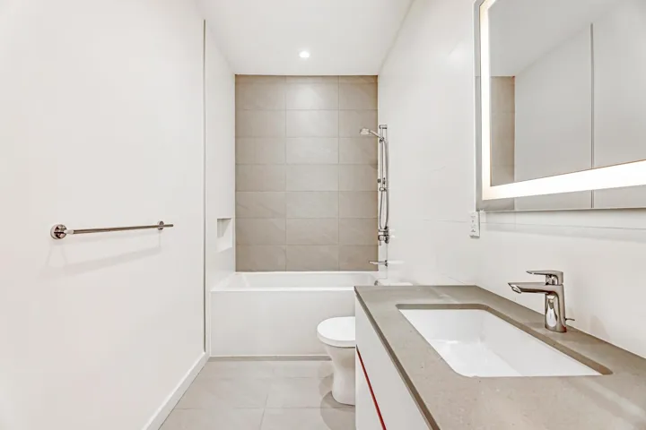 Full bathroom with tile patterned floors, vanity, toilet,  shower combination, and recessed lighting