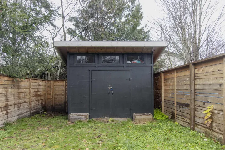 View of shed featuring a fenced backyard
