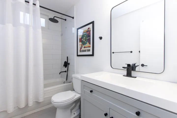 Bathroom with vanity and shower / bath combo