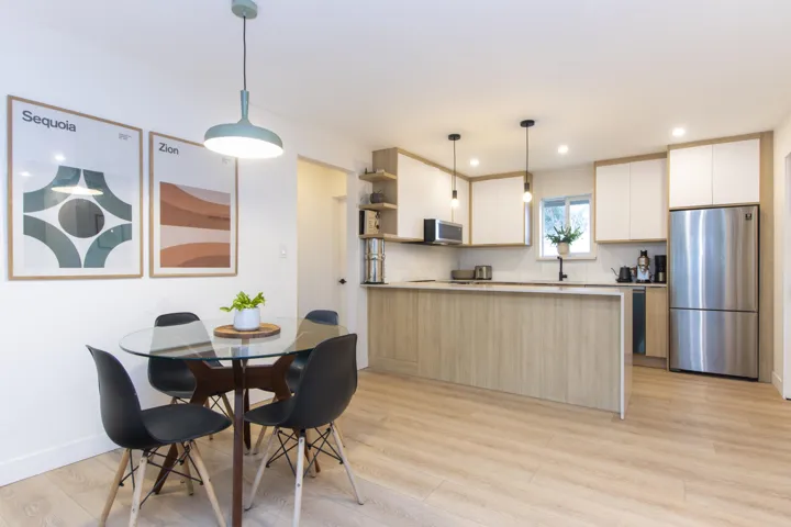 Dining space with light wood-type flooring and recessed lighting