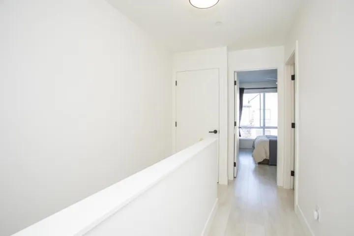 Bright hallway with light wood-finish flooring