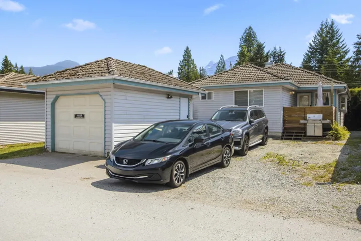 Attached garage with a panel-style door